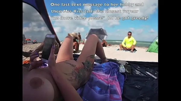 XXX EW 511 - Hubby Films Mrs Kandii Kiss and shows us what the voyeurs look like playing with their cocks when she lays out on the nude beach with her legs spread open for all to see skupno število filmov