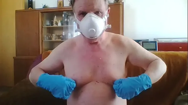 XXX Andreas with a dust mask and gloves picks one off total Movies